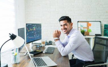 Happy Attractive Young Stock Broker Working At Home