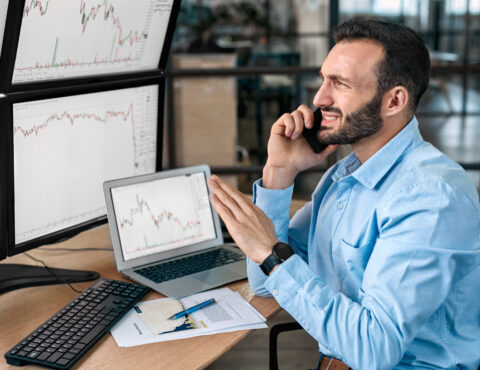 Worried Businessman Talking On Smartphone About Global Bitcoin Price