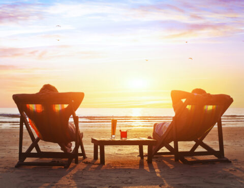 Happy Couple On The Beach