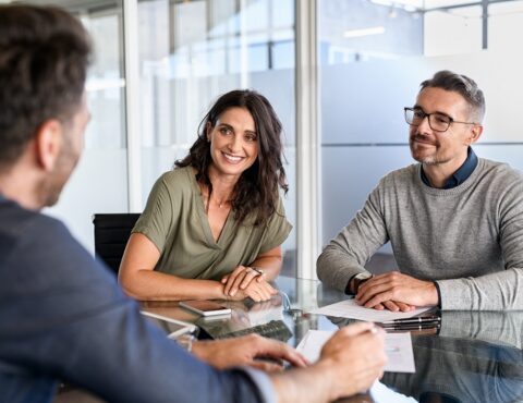 Mature Couple Meeting Financial Advisor For Investment