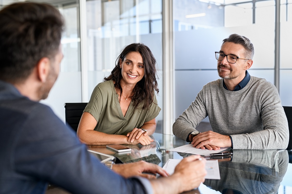 Mature Couple Meeting Financial Advisor For Investment