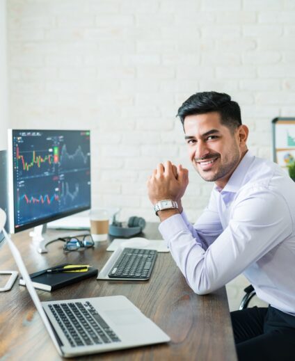 Happy Attractive Young Stock Broker Working At Home