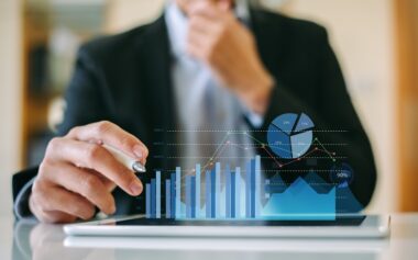 Businessman Investor Analyzing Company Financial Mutual Fund Report Working With Digital Augmented Reality Graphics Technology. Concept For Business, Economy And Marketing.